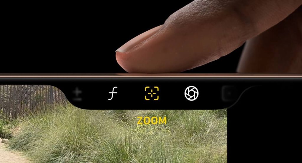 Finger touching side buttons for zooming